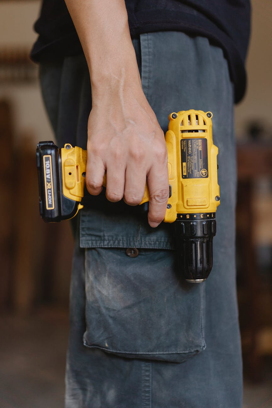 professional joiner with electric screwdriver